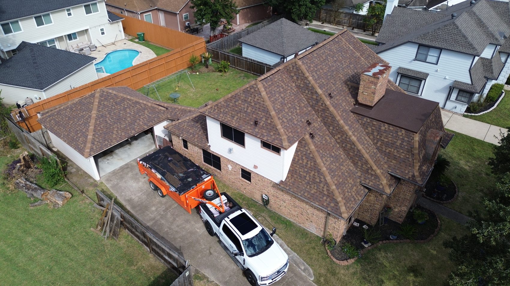 Aerial view of a completed full roof replacement system by Sienna Roofing